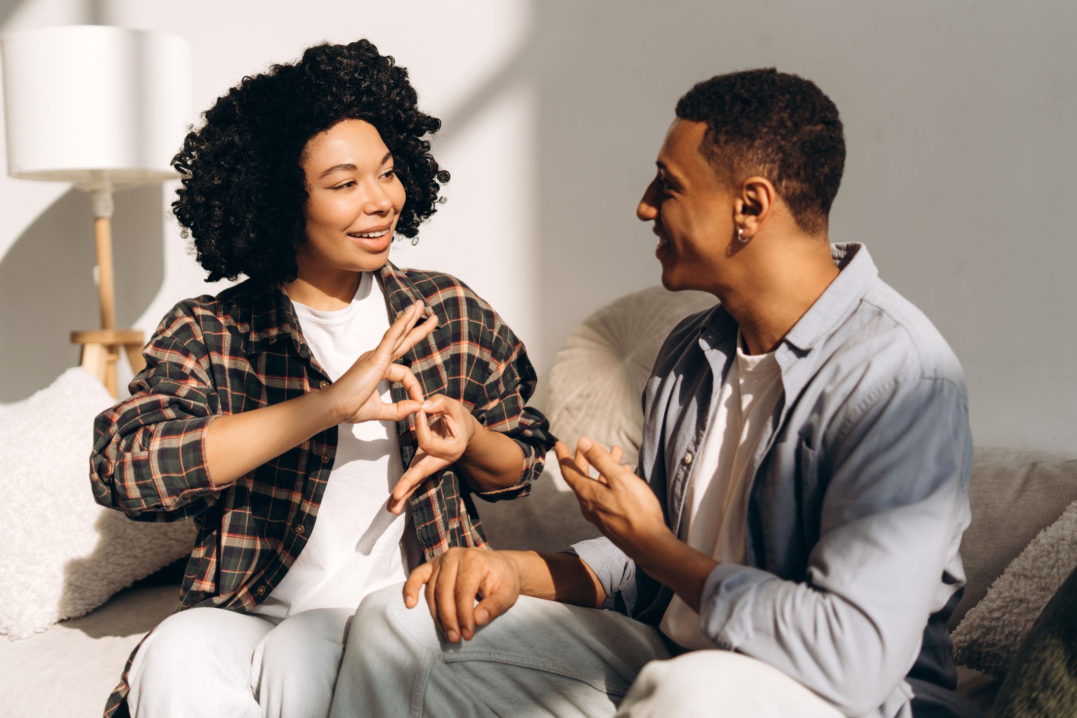 Two people communicating using sign language.